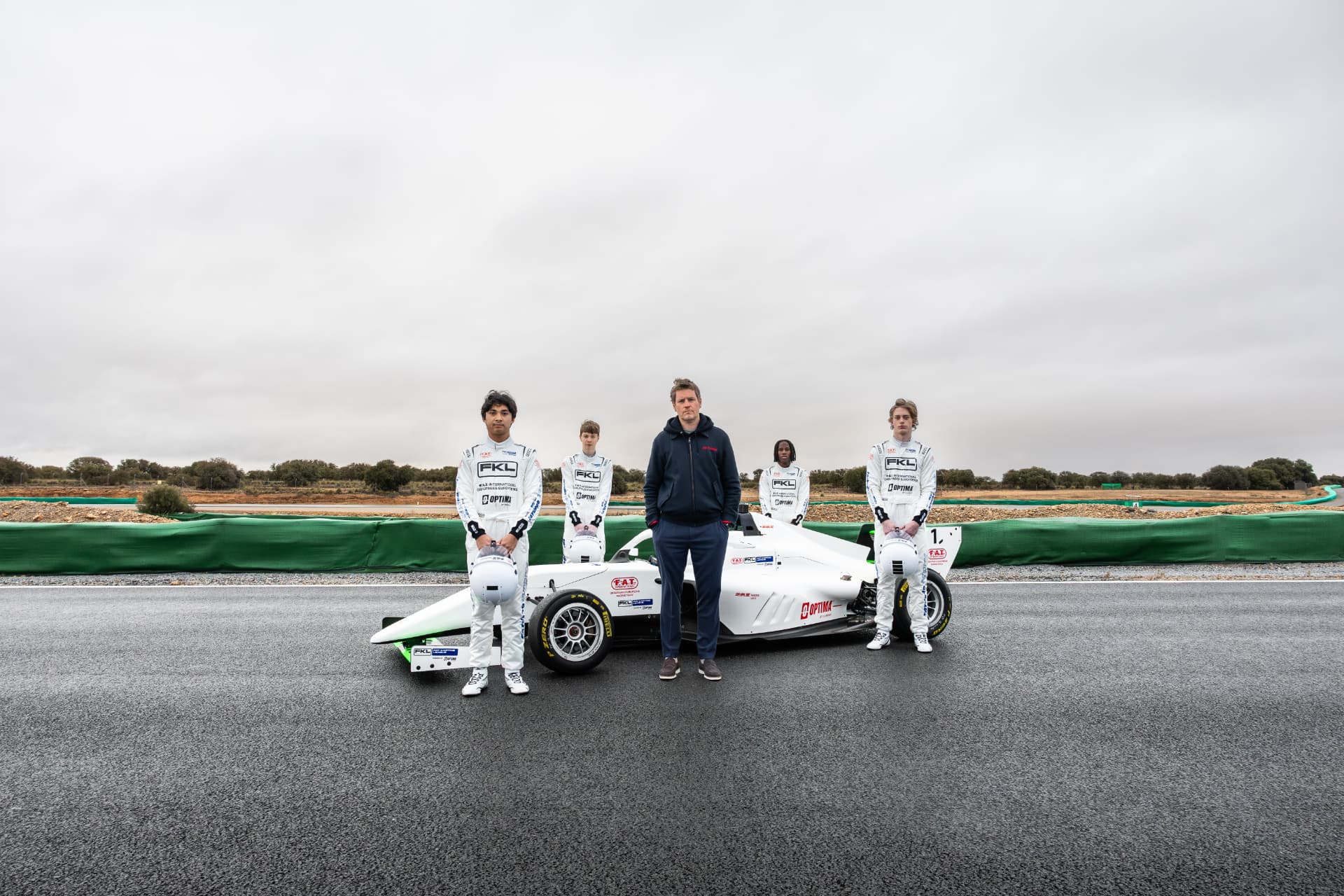 FKL F4 Shootout drivers with Rob Smedley beside a FAT Racing Formula 4 car