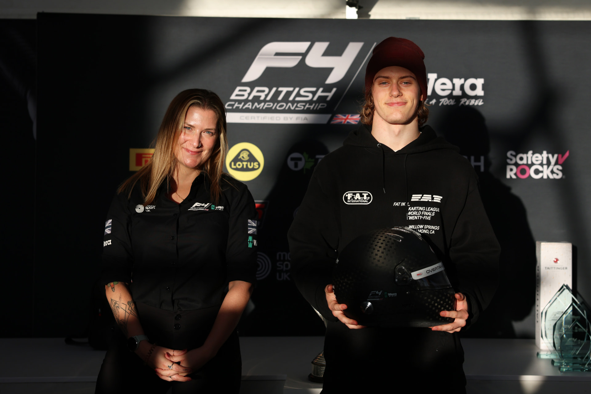Jackson Wolny holding the Bell Overtake Award helmet