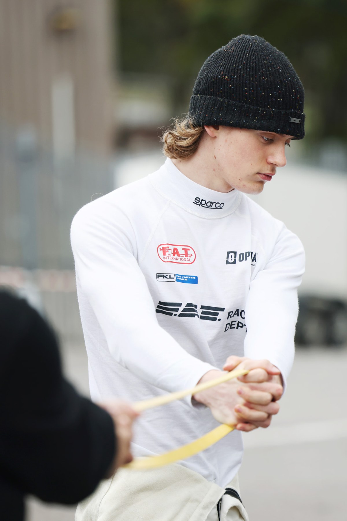 Jackson Wolny preparing in his FAT Racing race suit
